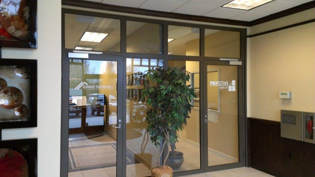Interior glass storefront doors in office reception area