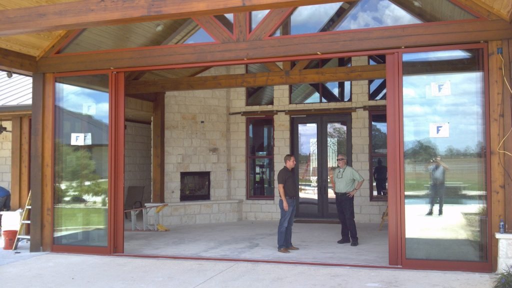 Glass storefront entry doors in timber-frame commercial building