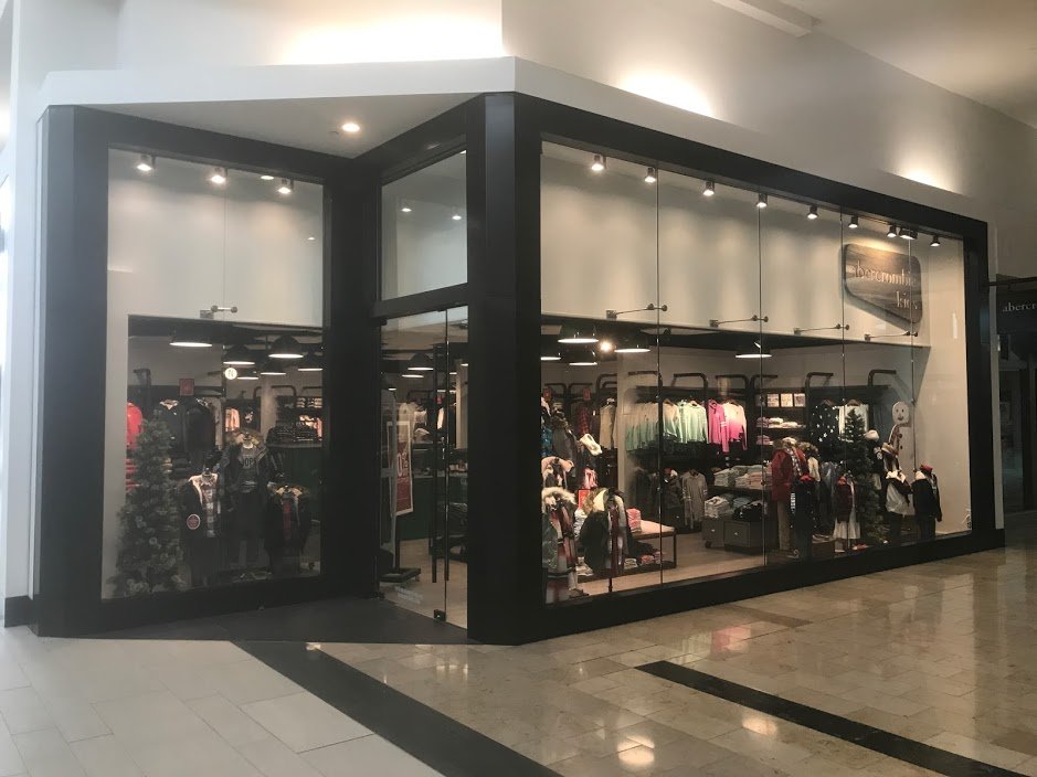 Glass storefront doors with overhead awning