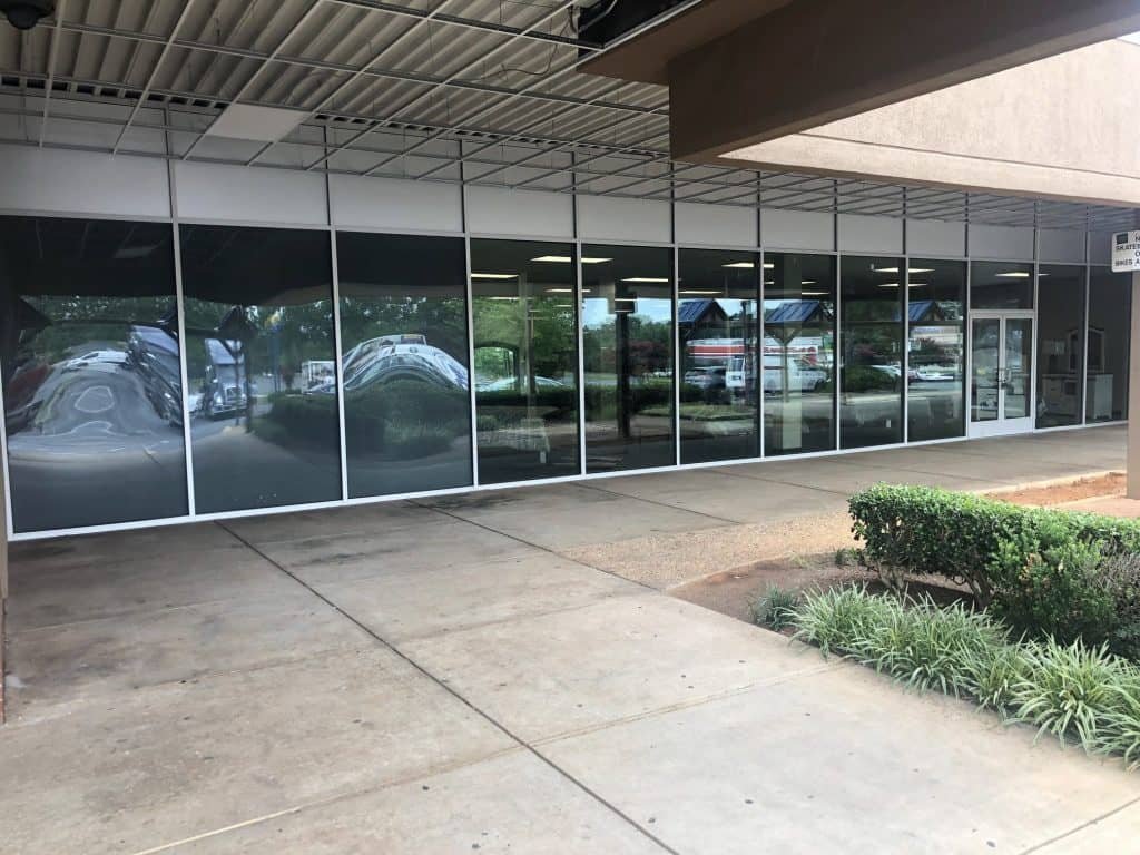 Multi-panel glass storefront doors